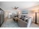 Serene living room boasts a comfortable sofa, stylish coffee table, and subtle decor that complements the wood-look flooring at 868 Bayway Blvd # 206, Clearwater Beach, FL 33767