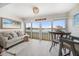 Bright living room with water views, beach decor and access to outdoor patio at 868 Bayway Blvd # 206, Clearwater Beach, FL 33767
