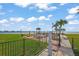 Bayfront community patio with tables and water views, perfect for outdoor relaxation at 868 Bayway Blvd # 206, Clearwater Beach, FL 33767