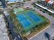 Aerial view of the community's well-maintained tennis courts and landscaping at 868 Bayway Blvd # 206, Clearwater Beach, FL 33767
