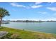Scenic water view from lush lawn; glimpse of the area's waterfront homes at 868 Bayway Blvd # 206, Clearwater Beach, FL 33767