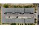 Birds eye captures symmetrical townhomes with structured landscaping and easy access to parking, promoting organized community living at 8723 Palm Ranches Pl, Tampa, FL 33614
