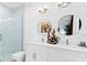 Modern bathroom featuring a glass shower, double sinks, and stylish decor at 8723 Palm Ranches Pl, Tampa, FL 33614