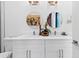 Bright bathroom with double sinks, modern fixtures, and stylish decor at 8723 Palm Ranches Pl, Tampa, FL 33614