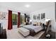 Elegant bedroom featuring hardwood floors, a large window, and sophisticated decor at 8723 Palm Ranches Pl, Tampa, FL 33614