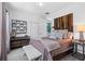Stylishly designed bedroom featuring a wooden headboard, soft bedding, and modern decor at 8723 Palm Ranches Pl, Tampa, FL 33614