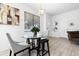 Cozy dining area with a glass table and stylish chairs, creating an inviting space at 8723 Palm Ranches Pl, Tampa, FL 33614