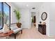 Inviting entryway with stylish seating, modern decor, and plenty of natural light at 8723 Palm Ranches Pl, Tampa, FL 33614