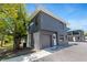 Contemporary two-story townhouse featuring a gray exterior, garage, and minimalist design at 8723 Palm Ranches Pl, Tampa, FL 33614