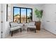 Bright living room features modern furniture, a large window, and neutral colors for a cozy and inviting atmosphere at 8723 Palm Ranches Pl, Tampa, FL 33614