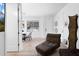 Open living area with modern furnishings and ample natural light from a window at 8723 Palm Ranches Pl, Tampa, FL 33614