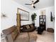 Modern living room featuring a brown sofa, unique lighting, and sleek decor at 8723 Palm Ranches Pl, Tampa, FL 33614