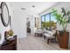 Bright sitting area with large window, comfortable chairs, and stylish decor at 8723 Palm Ranches Pl, Tampa, FL 33614