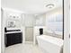 Beautiful bathroom featuring a stand alone tub, glass enclosed shower, and a modern vanity at 9203 Meadow Lane Ct, Tampa, FL 33647