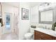 Modern bathroom with a glass-enclosed shower, dark wood vanity, and a pool view at 9203 Meadow Lane Ct, Tampa, FL 33647