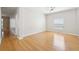 Bright bedroom features bamboo floors, a ceiling fan, and a large window for natural light at 9203 Meadow Lane Ct, Tampa, FL 33647