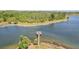 Scenic community dock on a lake with trees around the shoreline at 9203 Meadow Lane Ct, Tampa, FL 33647
