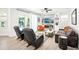 Cozy living room with a fireplace, built-in bookshelves, and a sliding door to the pool area at 9203 Meadow Lane Ct, Tampa, FL 33647