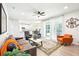 Open concept living room with a ceiling fan, recessed lighting, and a sliding door to the outdoor patio at 9203 Meadow Lane Ct, Tampa, FL 33647