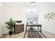 Serene home office with bright window, neutral walls, and ample workspace for productivity and comfort at 9203 Meadow Lane Ct, Tampa, FL 33647