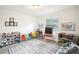 Bright and cheerful playroom with natural light, colorful furnishings, and ample storage for toys and learning at 9203 Meadow Lane Ct, Tampa, FL 33647