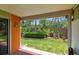View of the back yard with a view of the surrounding landscaping and brick privacy fence at 93 Boca Ciega Point N Blvd # 93, St Petersburg, FL 33708
