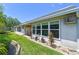 Landscaped backyard with thriving greenery, decorative rock borders, and a view of the well-maintained exterior at 93 Boca Ciega Point N Blvd # 93, St Petersburg, FL 33708