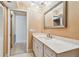 Bathroom with a vanity and a framed mirror at 93 Boca Ciega Point N Blvd # 93, St Petersburg, FL 33708