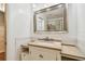 The bathroom features a cream vanity with stone countertop and a large mirror at 93 Boca Ciega Point N Blvd # 93, St Petersburg, FL 33708