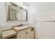 The bathroom features a cream vanity with stone countertop at 93 Boca Ciega Point N Blvd # 93, St Petersburg, FL 33708