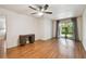 Spacious bedroom with wood-look floors, desk area, and sliding door to the lanai at 93 Boca Ciega Point N Blvd # 93, St Petersburg, FL 33708