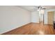 Spacious bedroom with wood-look floors and ceiling fan at 93 Boca Ciega Point N Blvd # 93, St Petersburg, FL 33708