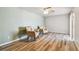 This bedroom features two accent chairs and wood-look flooring at 93 Boca Ciega Point N Blvd # 93, St Petersburg, FL 33708