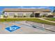 Exterior front view of the community clubhouse with parking spaces in front at 93 Boca Ciega Point N Blvd # 93, St Petersburg, FL 33708