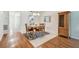 Dining area featuring hardwood floors and an open floor plan that leads to other rooms at 93 Boca Ciega Point N Blvd # 93, St Petersburg, FL 33708