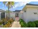 Charming home featuring a well-maintained front yard and decorative privacy wall under a clear blue sky at 93 Boca Ciega Point N Blvd # 93, St Petersburg, FL 33708