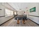 Bright game room features a full size pool table, wood floors and plenty of space for entertaining at 93 Boca Ciega Point N Blvd # 93, St Petersburg, FL 33708