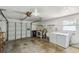 Bright garage space with laundry hookups, water heater, and storage options for tools and equipment at 93 Boca Ciega Point N Blvd # 93, St Petersburg, FL 33708