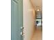Inviting hallway leading into a home featuring tiled floors and neutral paint at 93 Boca Ciega Point N Blvd # 93, St Petersburg, FL 33708