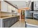 An open kitchen with stainless steel appliances and stylish cabinetry at 93 Boca Ciega Point N Blvd # 93, St Petersburg, FL 33708