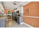 The kitchen has stainless appliances, and a view into the dining room at 93 Boca Ciega Point N Blvd # 93, St Petersburg, FL 33708