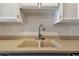 Close-up view of the clean, bright kitchen sink and backsplash at 93 Boca Ciega Point N Blvd # 93, St Petersburg, FL 33708