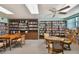 Community library with bookshelves lining the walls and comfortable seating for reading and relaxation at 93 Boca Ciega Point N Blvd # 93, St Petersburg, FL 33708