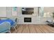 Open-concept living room area complete with a modern fireplace, television, and comfortable seating at 93 Boca Ciega Point N Blvd # 93, St Petersburg, FL 33708