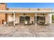 Covered patio with stone floors, ceiling fans, and multiple tables with seating at 93 Boca Ciega Point N Blvd # 93, St Petersburg, FL 33708