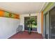View of the tiled outdoor patio with sliding glass doors at 93 Boca Ciega Point N Blvd # 93, St Petersburg, FL 33708