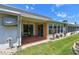 Inviting patio with comfortable seating and picturesque backyard views, surrounded by lush green lawn at 93 Boca Ciega Point N Blvd # 93, St Petersburg, FL 33708