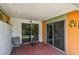 View of the outdoor tiled patio area with sliding glass doors at 93 Boca Ciega Point N Blvd # 93, St Petersburg, FL 33708