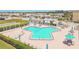 Relaxing Y-shaped pool surrounded by lounge chairs and well-maintained landscaping at 93 Boca Ciega Point N Blvd # 93, St Petersburg, FL 33708
