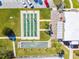 Aerial view of shuffleboard court and bocce ball court with a grassy surround at 93 Boca Ciega Point N Blvd # 93, St Petersburg, FL 33708